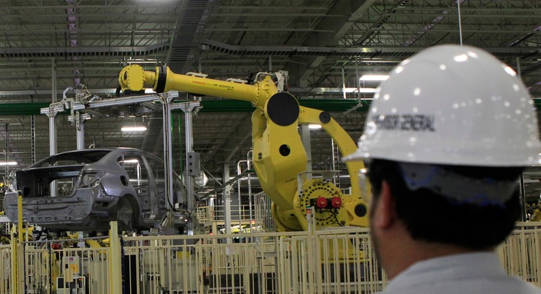 An employee looks at the production line of Nissan's new plant in Aguascalientes, Mexico.