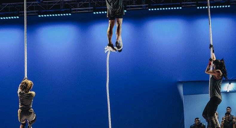 In the Wings of Icarus challenge, Physical: 100 contestants struggle to hang onto the rope.Physical: 100/Netflix