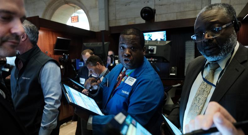 Traders work on the floor of the New York Stock Exchange (NYSE) on March 20, 2020 in New York City.