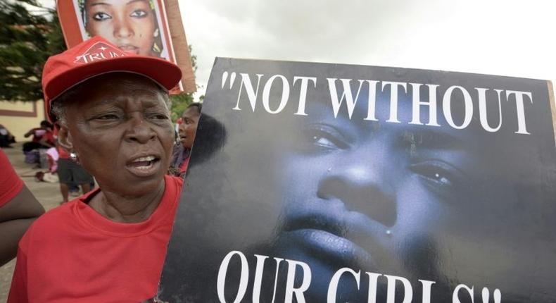 A member of Bring Back Our Girls movement carries placard to press for the release of the missing Chibok schoolgirls in Lagos, on April 14, 2016