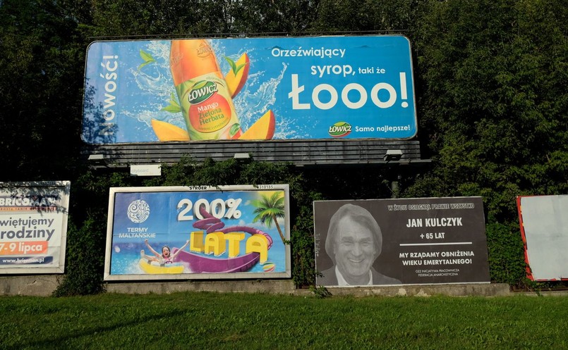 Reklama z wizerunkiem Jana Kulczyka