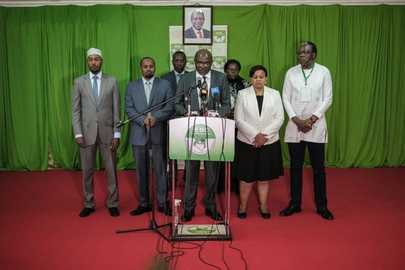 Wafula Chebukati (C), the Chairman of Independent Electoral and Boundaries Commission (IEBC), speaks during a media briefing on the voter register at Bomas of Kenya in Nairobi, Kenya, on June 20, 2022. (Photo by YASUYOSHI CHIBA/AFP via Getty Images)