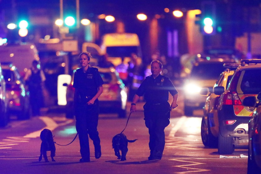 A man prays after a vehicle collided with pedestrians near a mosque in the Finsbury Park neighborhoo