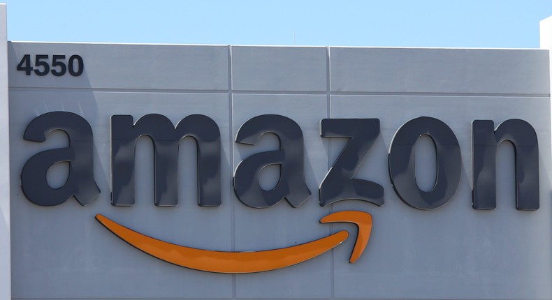 An Amazon logo is displayed on a fulfillment center. Being the world's largest online retail company, Amazon operates more than 175 fulfillment centers worldwide, totaling in over 166 million square feet.