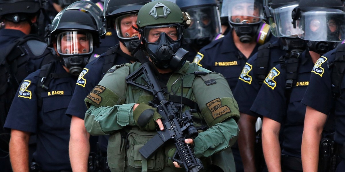 Law officers stand on a street during protests in Baton Rouge, Louisiana, U.S., July 10, 2016.