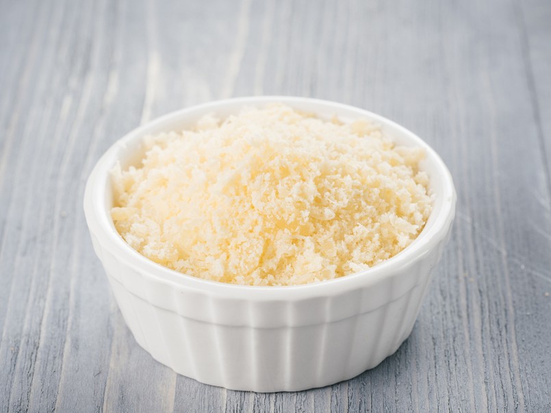 White,Ceramic,Bowl,With,Freshly,Grated,Parmesan,Cheese,On,Gray