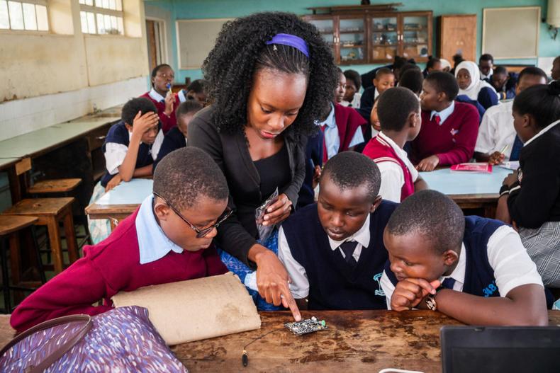 A Young Scientists Kenya (YSK) instructor guides Science, Technology, Engineering, and Mathematics (STEM) learners during a workshop in Nairobi