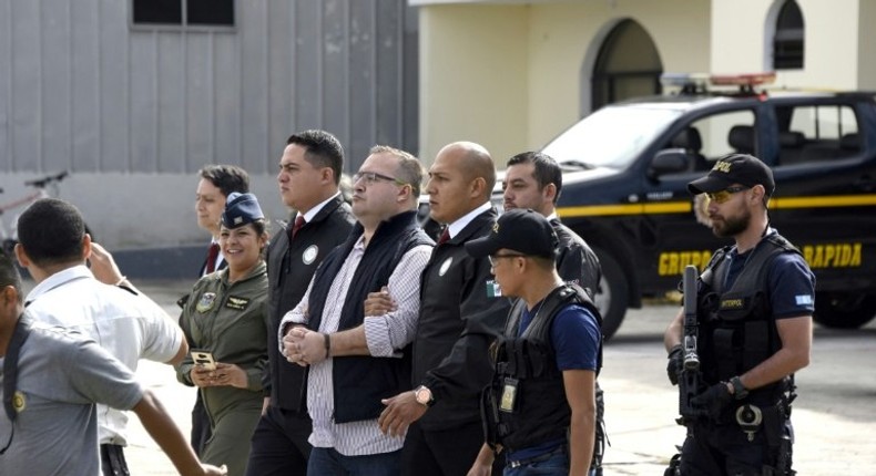 Guatemalan police put former Mexican governor Javier Duarte (C), on a plane to Mexico to face racketeering and money-laundering charges