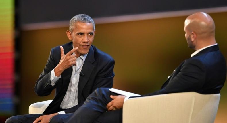 Former US president Barack Obama is interviewed by his former White House chef Sam Kass in front of a paying audience in Milan, Italy