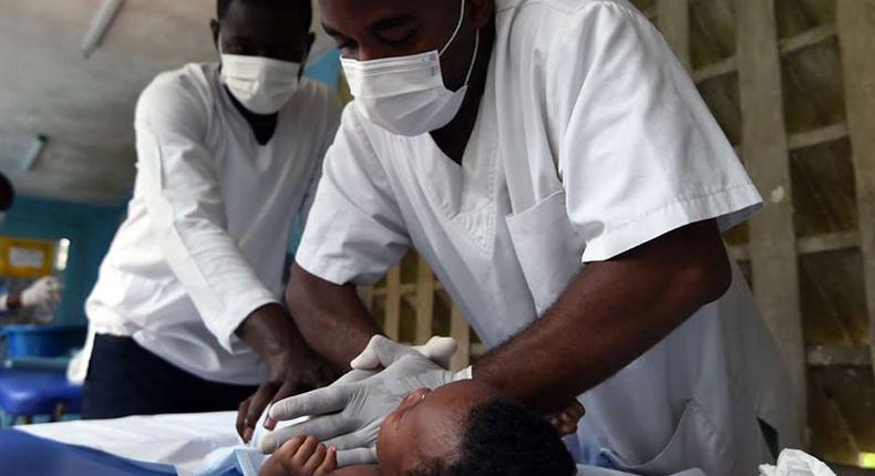 Medics treating a child at a hospital
