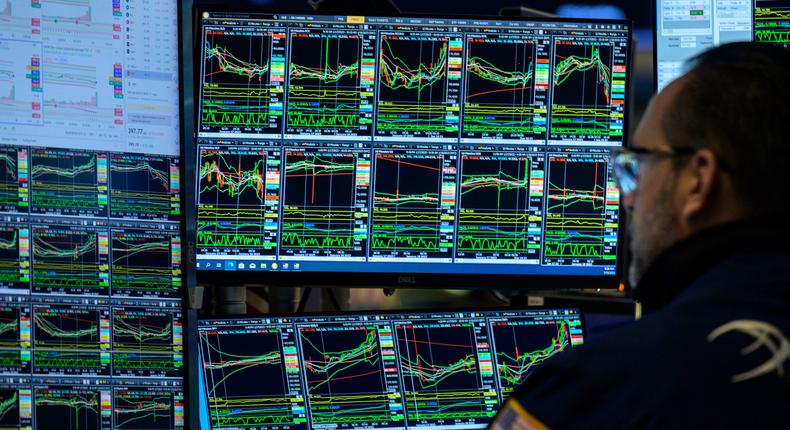 A trader looks at market charts on the floor of the New York Stock Exchange on January 18, 2023.Angela Weiss/AFP/Getty Images