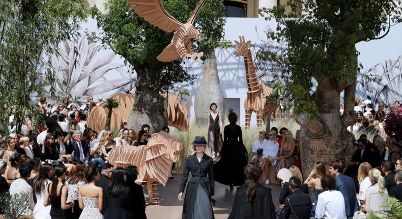 Models present creations for Christian Dior during the 2017 fall/winter Haute Couture collection in Paris