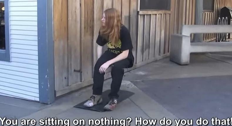 In this video, a man pretends to levitate in the air (sitting on an invisible chair). 