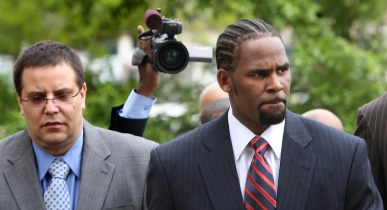 R. Kelly, right, with manager Derrel McDavid 