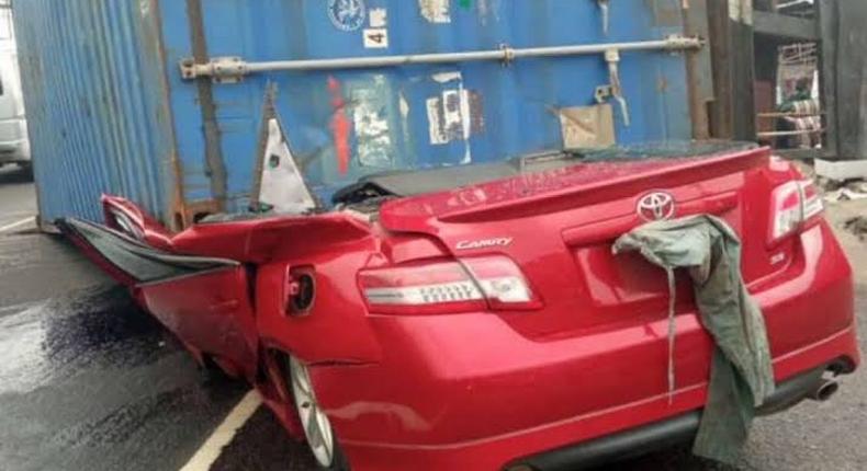 Truck carrying 40ft container falls on car in Lagos