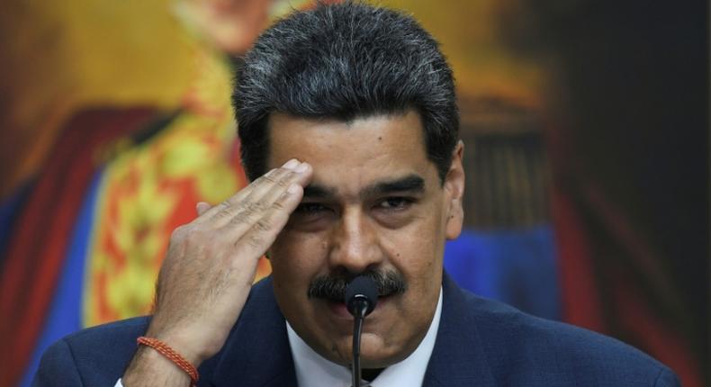 (FILES) In this file photo taken on February 14, 2020 Venezuela's President Nicolas Maduro gestures during a press conference