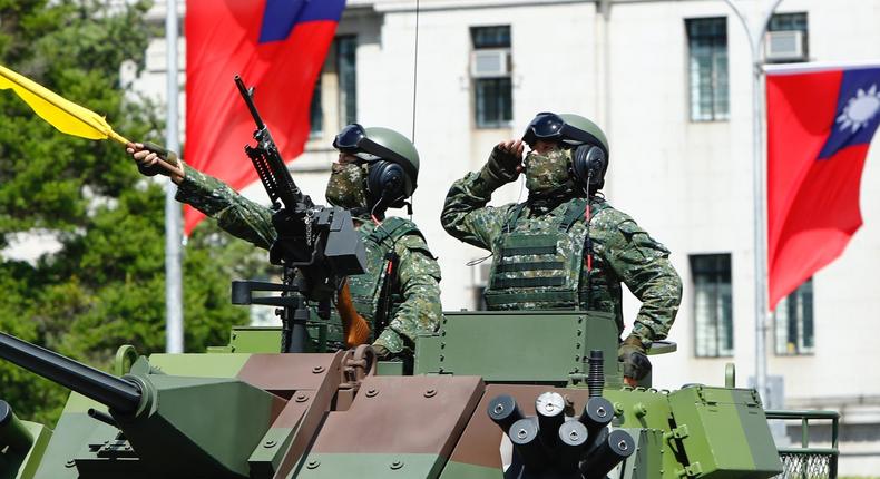 Taiwanese soldiers on an armored vehicle during the National Day Celebration in Taipei, October 10, 2021.
