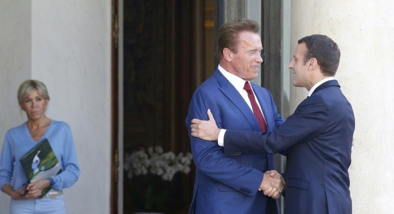 French President Emmanuel Macron, seen welcoming ex-California governor-turned climate campaigner Arnold Schwarzenegger to Paris, is hosting the launch of a draft Global Environment Pact