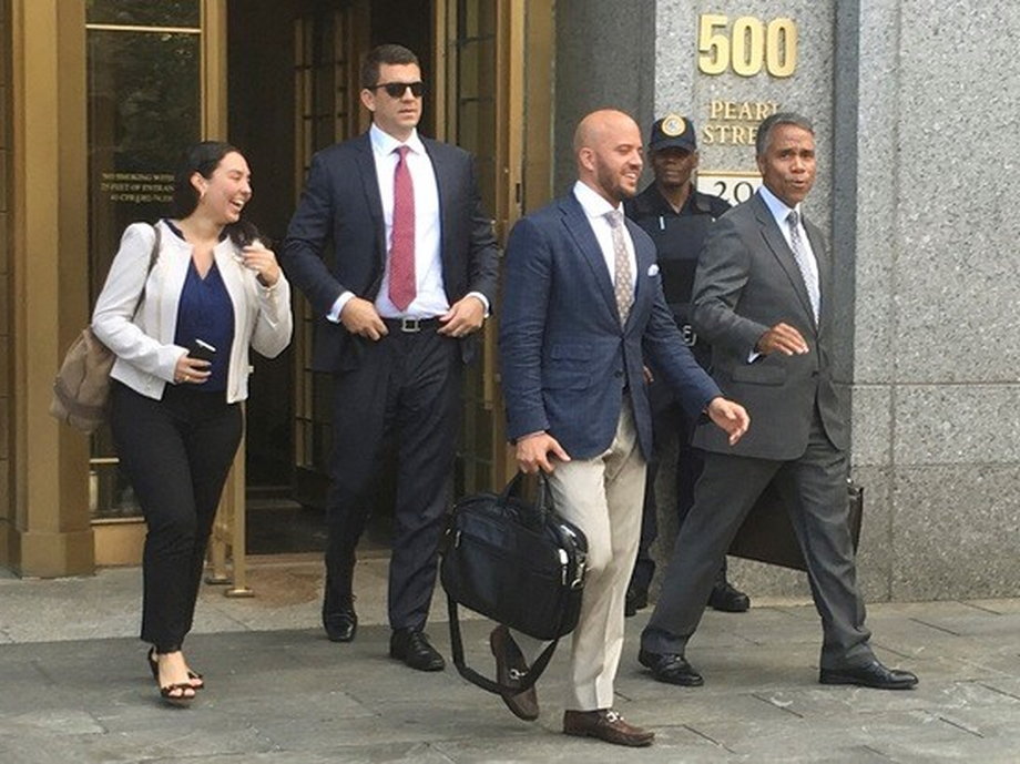 Jonathan Roper Fernando Serrano walk with Serrano’s lawyer Jude Cardenas after they pleaded not guilty in Manhattan New York