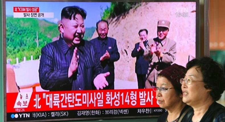 North Korean leader Kim Jong-Un hinted that he would hold off on plans to test-fire missiles towards Guam