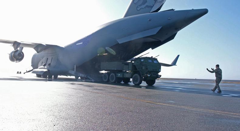 A US Air Force airman guides a M142 HIMARS from the back of a C-17 Globemaster III after landing on Shemya Island, Alaska on September 12, 2024.(US Army photo by Spc. Brandon Vasquez)