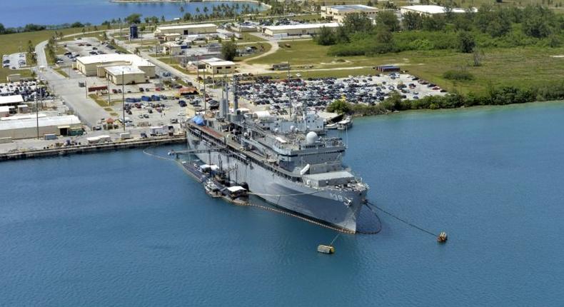 This image obtained from the US Department of Defense shows the submarine tender USS Emory S. Land and the Los Angeles-class attack submarine USS Topeka pierside in their home port at Polaris Point, Guam