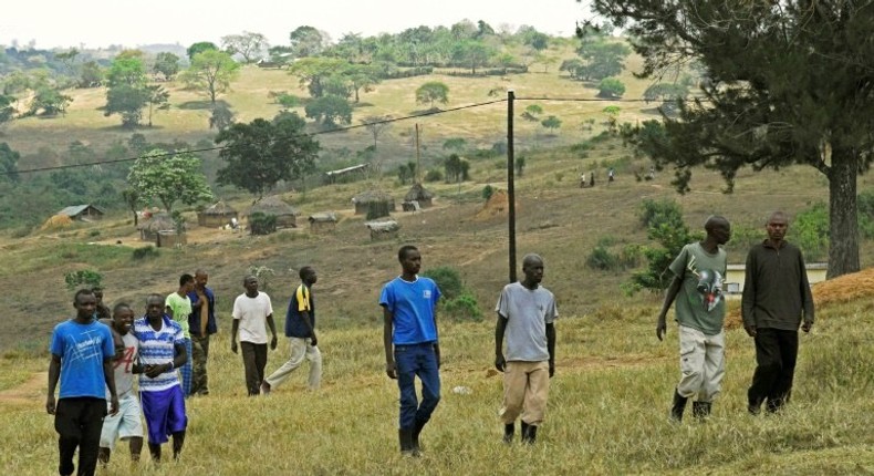 Members of the Democratic Republic of Congo (DRC) rebel group M23 wait at the Bihanga military base in Uganda, about 400 kilometres west of the capital Kampala on February 8, 2017