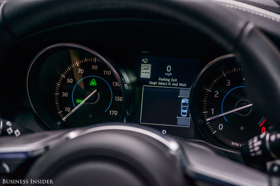 The analog cluster does feature an adjustable central display screen. Here the screen is presenting information from the car's parking assist program.