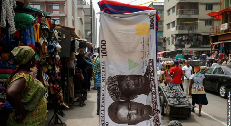 A towel with a print of the Nigerian naira is displayed for sale at a street market in Lagos (Illustrative image) [REUTERS/Akintunde Akinleye]