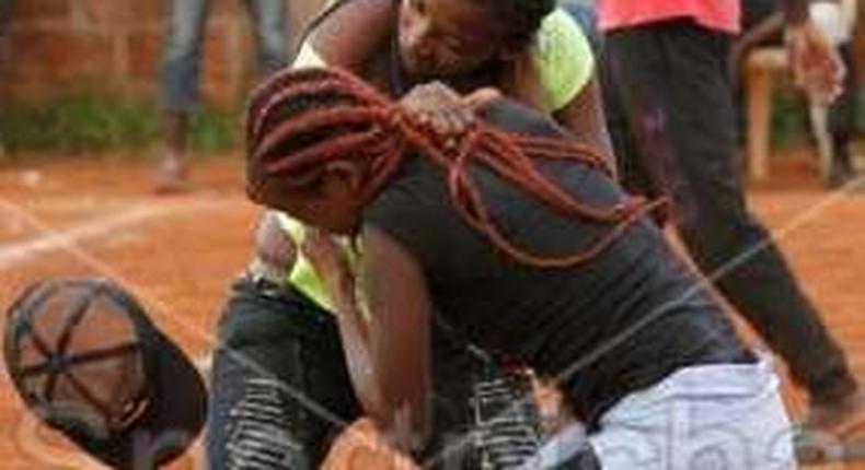Women exchange blows over man during a football match in Kenya