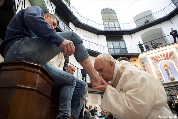 Pope Francis kisses the foot of an inmate at the Regina Coeli prison during the Holy Thursday celebr