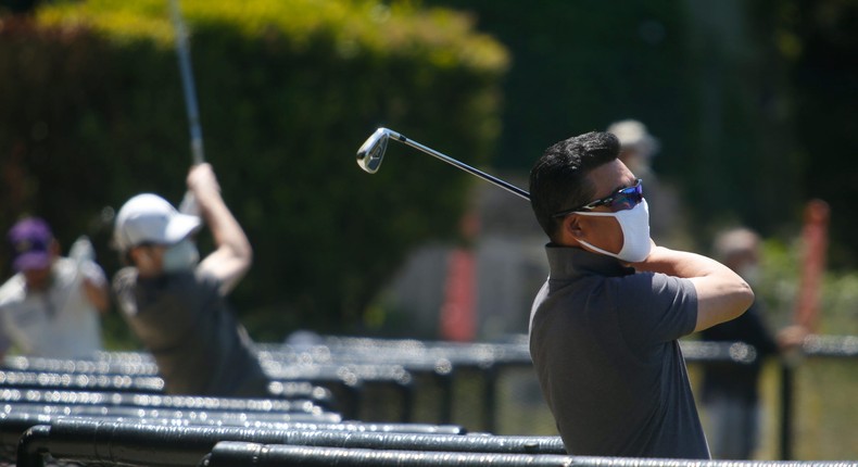 Golfers at the driving range at Presidio Golf Course in San Francisco in May 2020.
