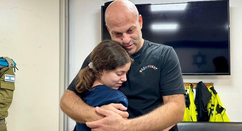 Hila Rotem Shoshani is embraced by her uncleThe Israeli Army/AP