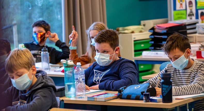 Students wearing masks in school.
