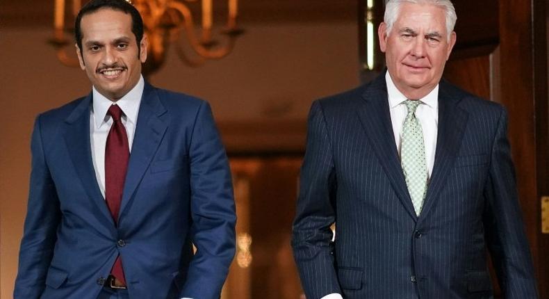 Qatari Foreign Minister Sheikh Mohammed bin Abdulrahman Al-Thani(L) heads into talks with US Secretary of State Rex Tillerson in Washington on June 27, 2017