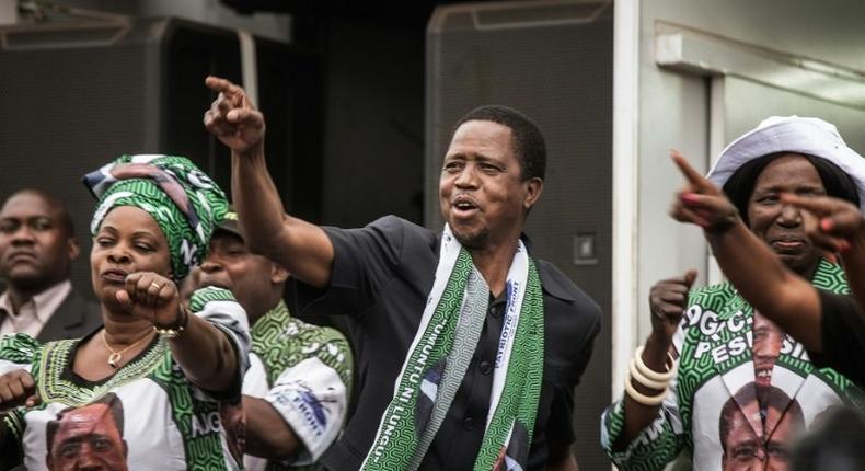 Edward Lungu (C) was narrowly reelected as Zambia's president with 50.35 percent of the vote