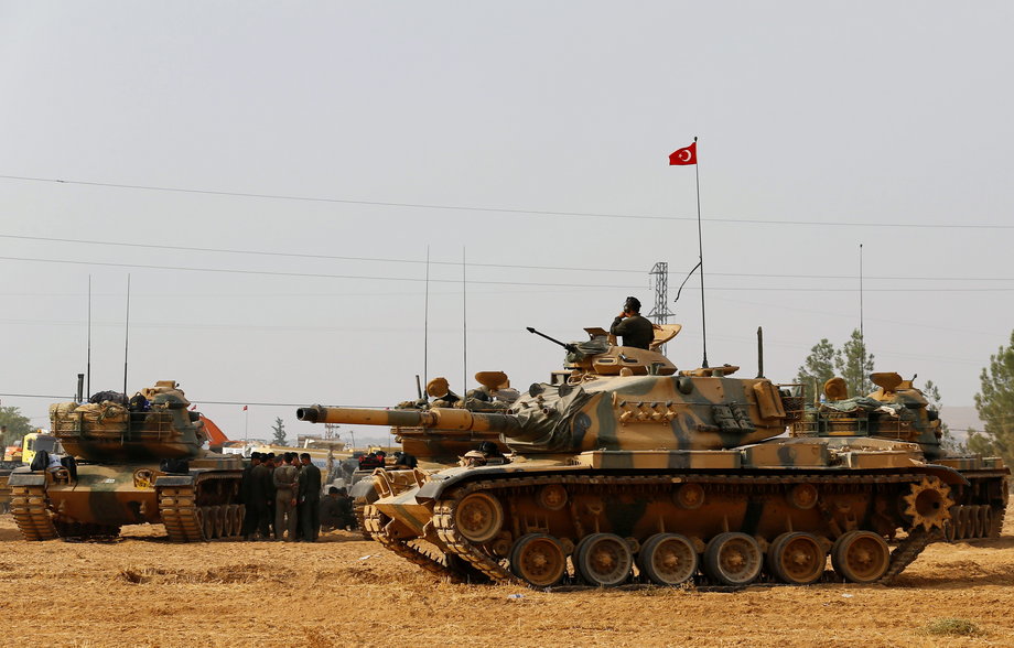 Turkish army tanks and military personal are stationed in Karkamis on the Turkish-Syrian border in the southeastern Gaziantep province, Turkey, August 25, 2016