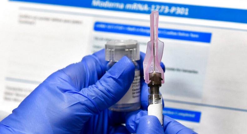 In this Monday, July 27, 2020 file photo, a nurse prepares a shot as a study of a possible COVID-19 vaccine, developed by the National Institutes of Health and Moderna Inc., gets underway in Binghamton, N.Y.
