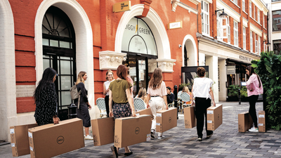 Company employees struggle to carry heavy boxes that contain Dell computing items through West End Streets, on 23rd August 2022, in London, England