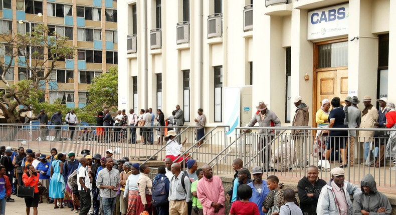 People queueing to withdraw money from a bank in Zimbabwe in November 2019.Philimon Bulawayo/Reuters