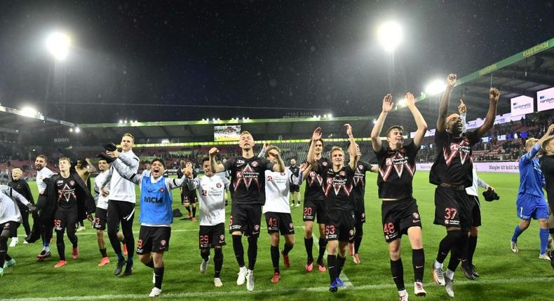 Danish delight: Midtjylland's players celebrate after defeating Celtic Creator: Bo Amstrup