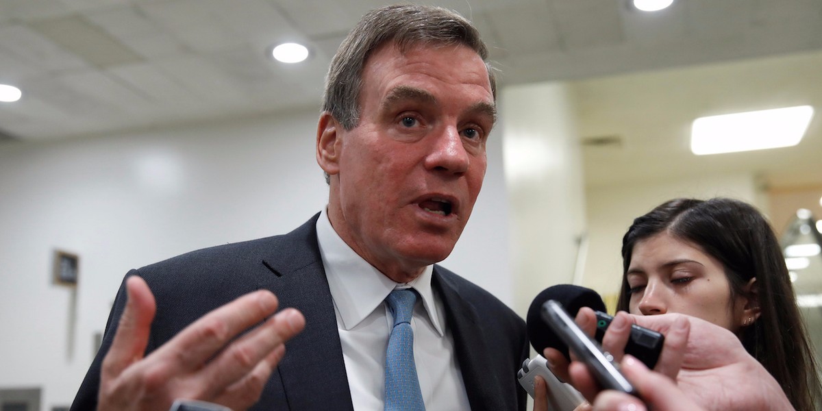 Sen. Mark Warner (D-VA) speaks with reporters.