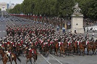 French troops of the Republican Guard on horseback attend the Bastille Day military parade on the Ch