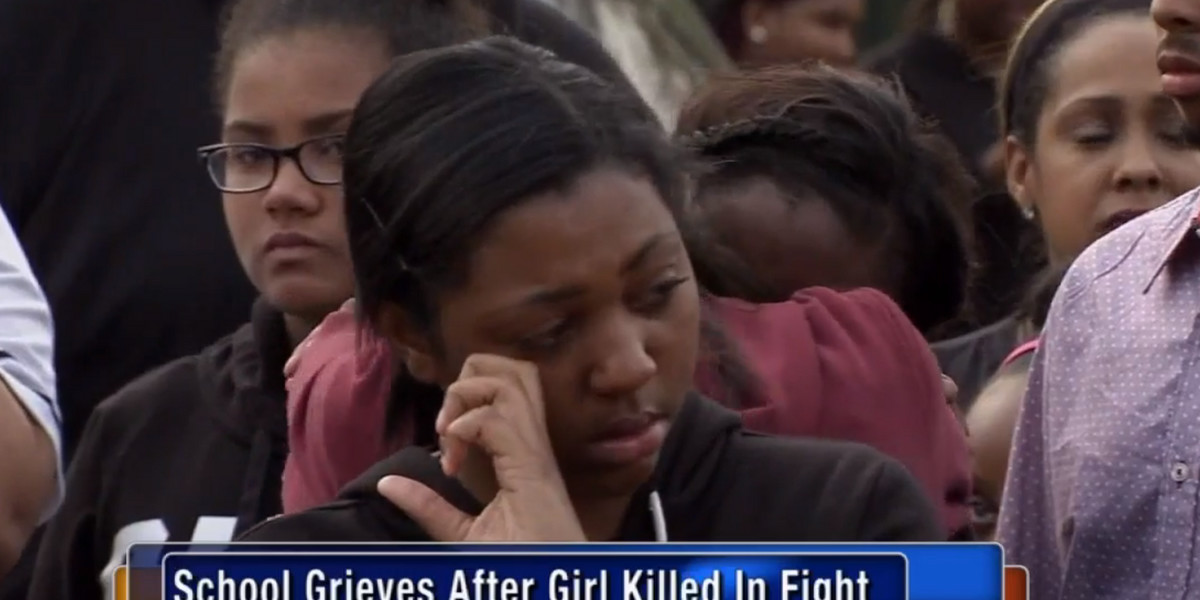 Students at the Howard High School of Technology grieve the loss of their classmate.