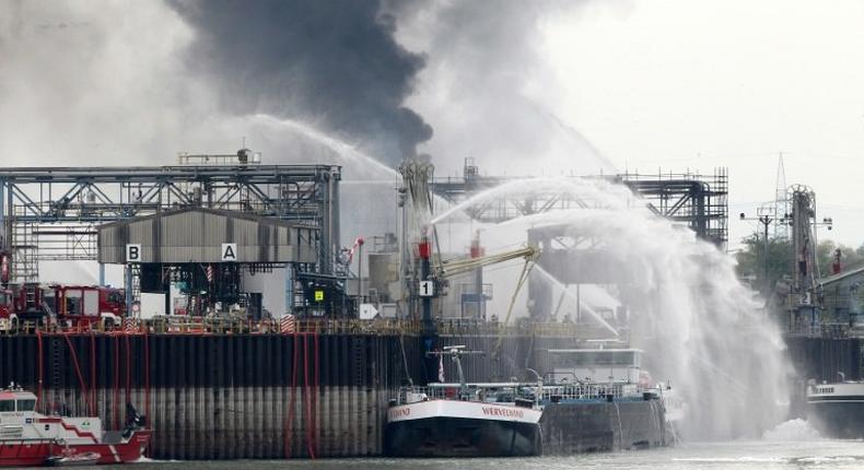 Smoke rises from a chemical plant at BASF's headquarters in western Germany on October 17, 2016