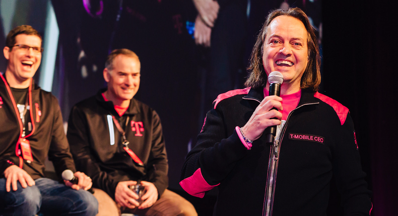 T-Mobile US CEO John Legere speaks at a rehearsal for the 2017 T-Mobile Winners Circle event. CMO Andrew Sherrard and general counsel David Miller look on.