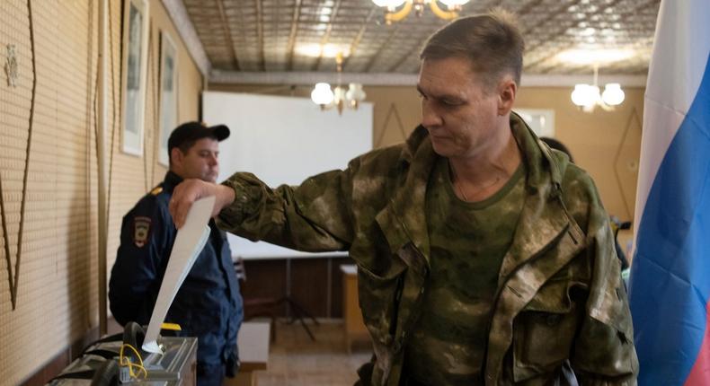 A Luhansk People's Republic serviceman votes in a polling station in Luhansk People's Republic, which is controlled by Russia-back separatists, on September 23, 2022.