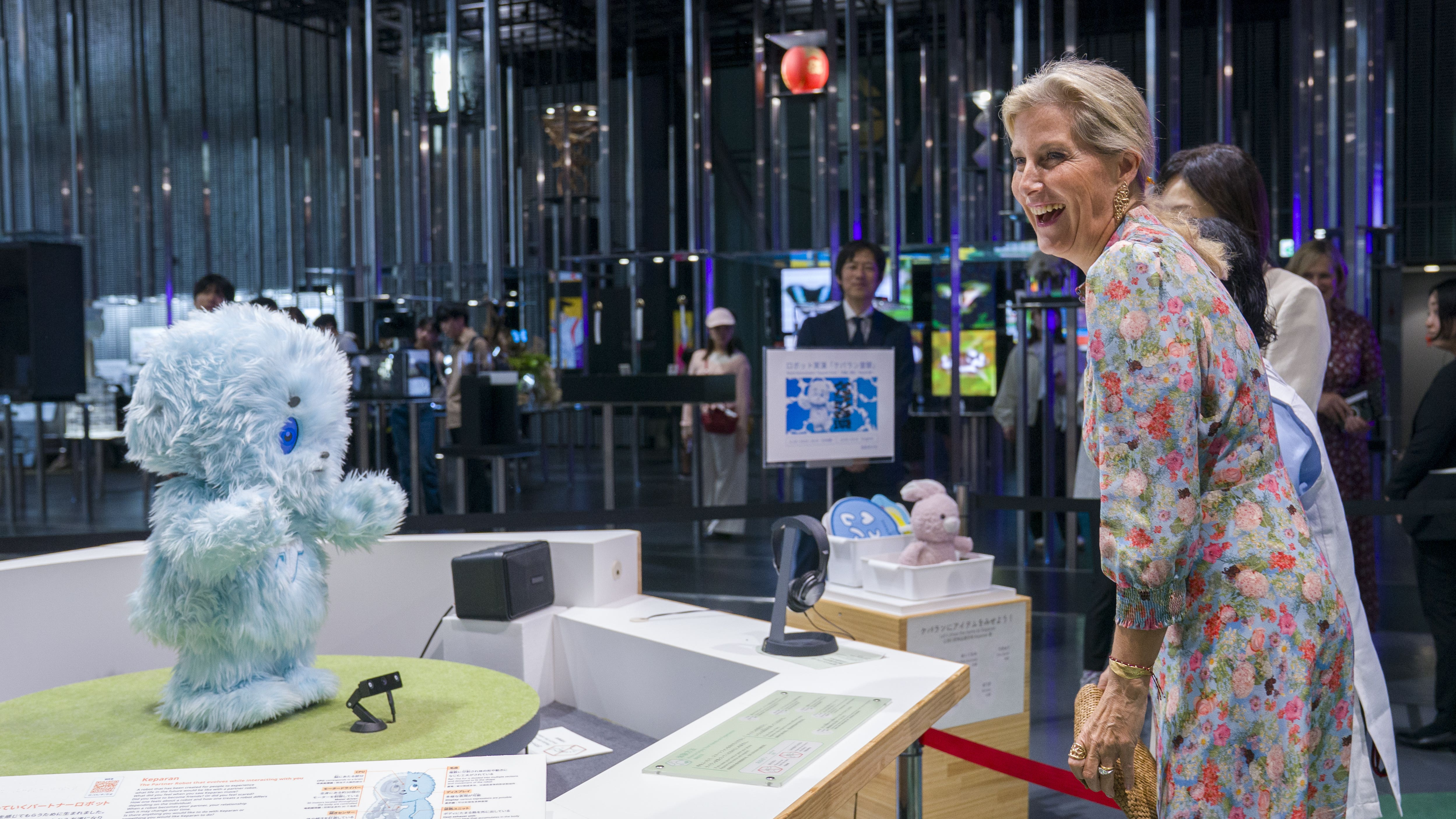 Duchess laughs with robots during Tokyo science visit