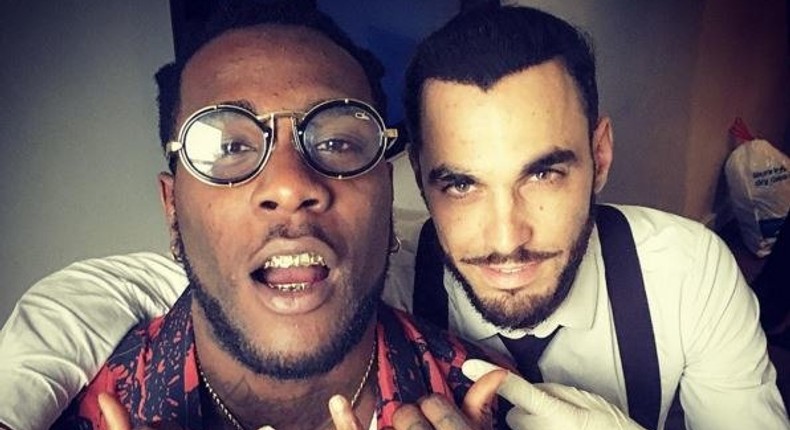 Burna Boy, 24, showing off his grill. 