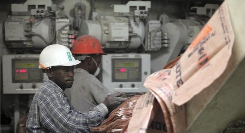 Labourers work at the Dangote Cement factory in Obajana village in Nigeria's central state of Kogi November 8, 2010. REUTERS/Akintunde Akinleye